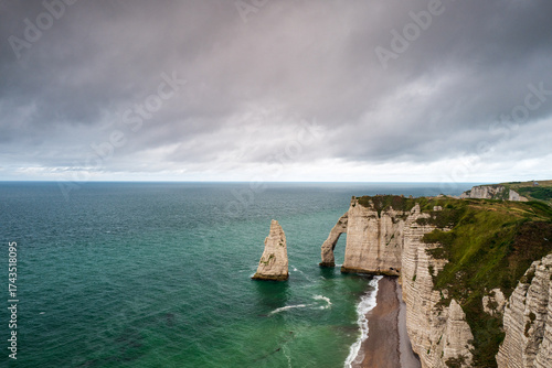Landscape of the Porte d’Aval Cliff, natural rock arch and beach of the alabaster coast, city of Etretat, department of Seine Maritime, Normandie region, France.