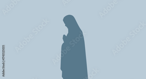 Silhouette of a praying figure in a moment of quiet contemplation and devotion.