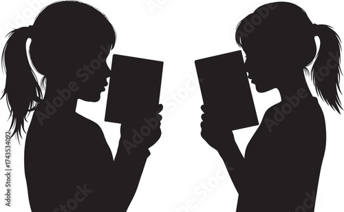 Two girls reading books in silhouette style