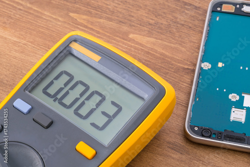 Voltage measuring devices and phone display, close-up