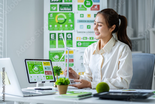 ESG professional develops green business strategy analyzes climate data promotes renewable energy solutions for sustainable future office