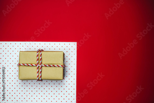 Christmas composition with gifts on a red background.