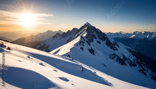 Snow capped mountain peak illuminated by the sun against a clear blue sky
