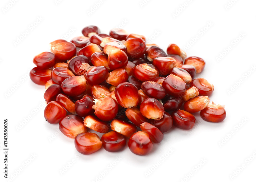 Obraz premium Pile of ripe red corn kernels isolated on white