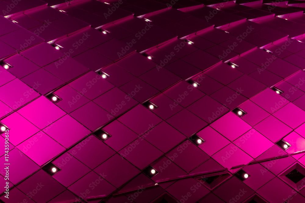 Fototapeta geometric, metallic surface featuring a grid pattern of square tiles. The tiles are illuminated with vibrant lighting, creating a dynamic, abstract and visually striking, modern architectural facade