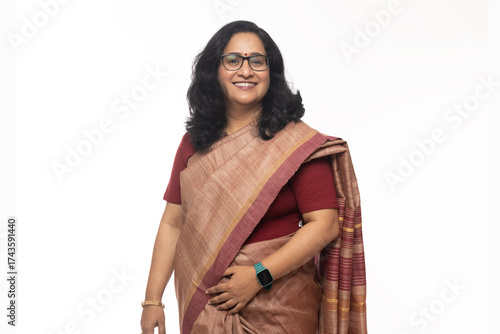 Canvas Print Beautiful Indian confident woman posing in traditional saree on white