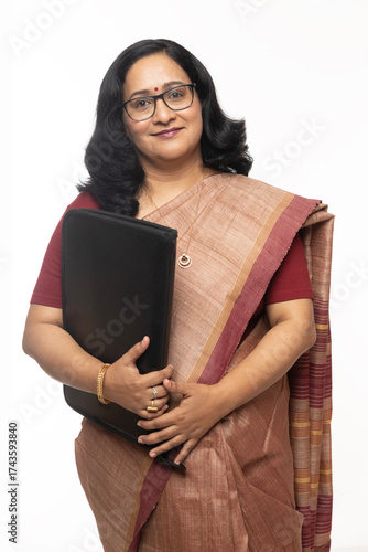 Photography Beautiful Indian confident woman or teacher posing in traditional saree on white