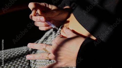 Woman injecting fertility hormone for egg freezing procedure