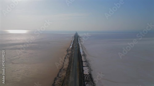 Aerial view of the Road to Heaven, Dholavira, stretching across the White Rann of Kutch, India, Stunning desert landscape with endless salt flats and a serene sky,  Road to heaven, Rann of Kutch
