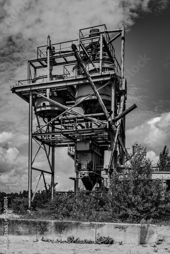 Dilapidated and abandoned industrial installation in monochrome