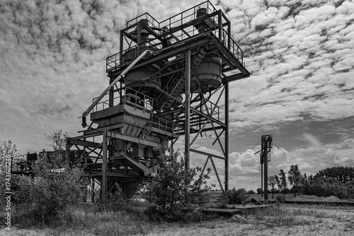 Dilapidated and abandoned industrial installation in monochrome