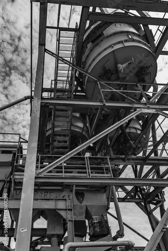 Dilapidated and abandoned industrial installation in monochrome