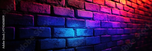 A vibrant, textured wall of bricks illuminated with colorful lights, creating an energetic and dynamic atmosphere.