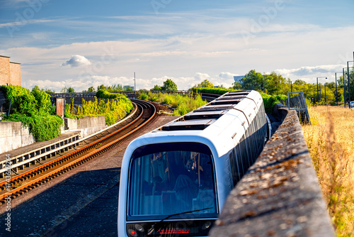 Photography Copenhagen Metro line moves around a curve in tracks, Denmark