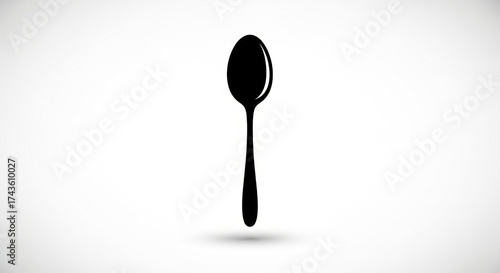 Black silhouette of a spoon isolated on white background
