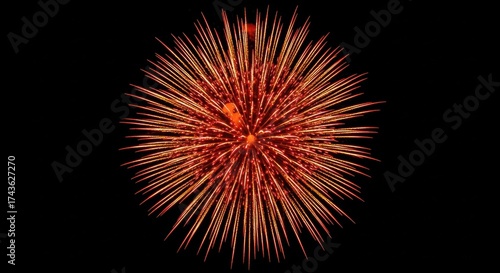 Golden explosion of light isolated on a black sky backdrop creating a dynamic visual experience