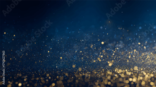 A beautiful abstract background featuring golden and blue bokeh lights, creating a festive and magical atmosphere