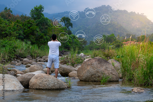 Young man hand using smartphone with to Interconnect, Interconnected Concept; People connect via wireless internet in a world of digital technology and communications that connect