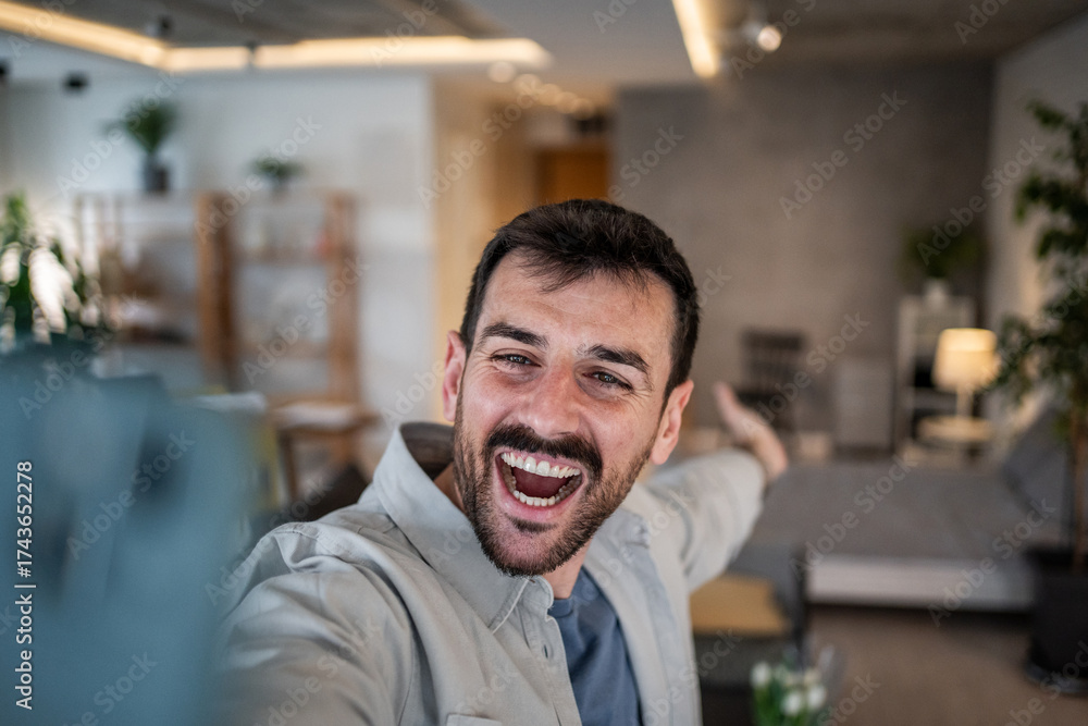 Fototapeta premium Happy man vlogging for social media content