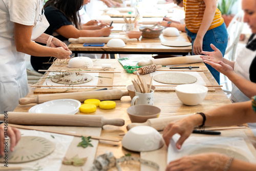 People taking ceramics pottery class workshop