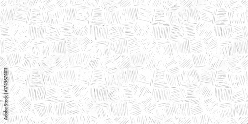 Abstract seamless pattern of hand drawn sketchy lines and dashes in a light gray on white background