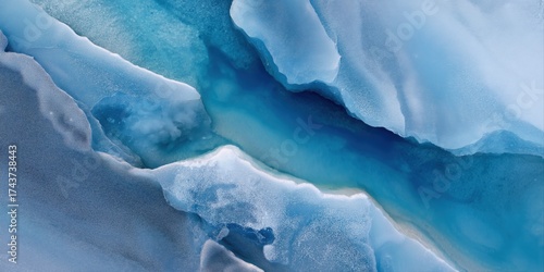 Aerial view of blue icy glacier crevices and frozen water patterns