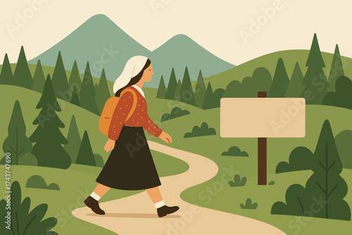 Woman hiking on forest path with mountains in the background