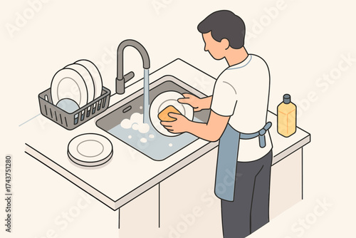 Man washing dishes in kitchen sink with soap and water