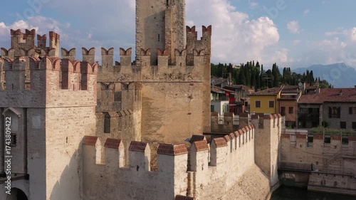 Wallpaper Mural Lake Garda Sunrise: Slow Flight Drone Video Over Scaligero Castle of Sirmione, Italy – A Medieval Landmark in Morning Sun Torontodigital.ca