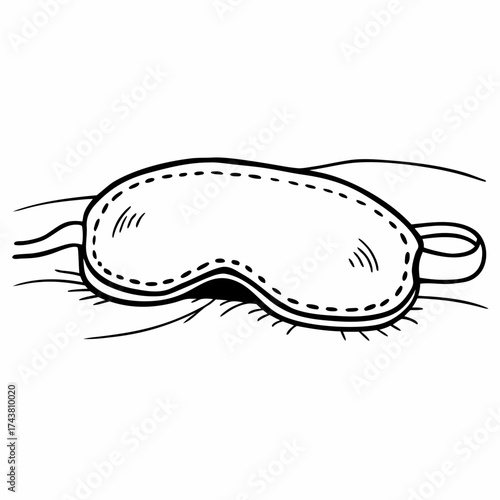 A simple black and white drawing of a sleeping mask resting on a pillow with soft lines around it