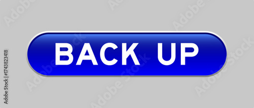 Blue color capsule shape button with word back up on gray background