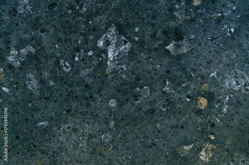 Optical microscope image revealing graphite flakes embedded in a pearlite and alpha ferrite matrix of gray cast iron after sample preparation.