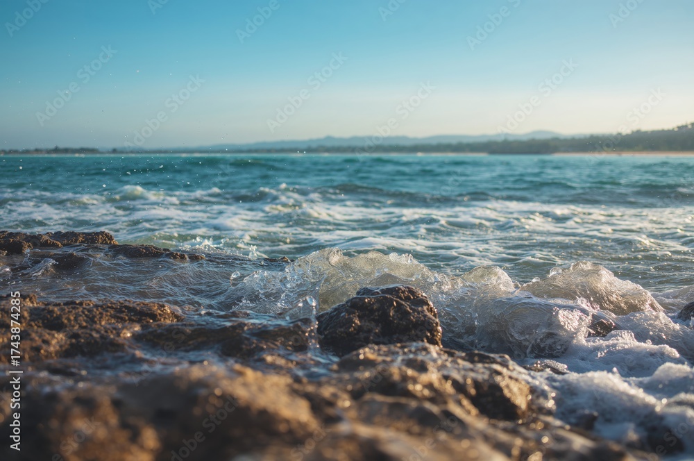 Fototapeta premium Abstract pattern of waves crashing against rocks with water and sky elements