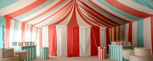  colorful tent interior features stripes of red, white, and blue, creating a festive atmosphere with tables and decorative elements.