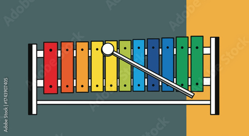 Colorful cartoon xylophone with a mallet, on a split background of grey and yellow