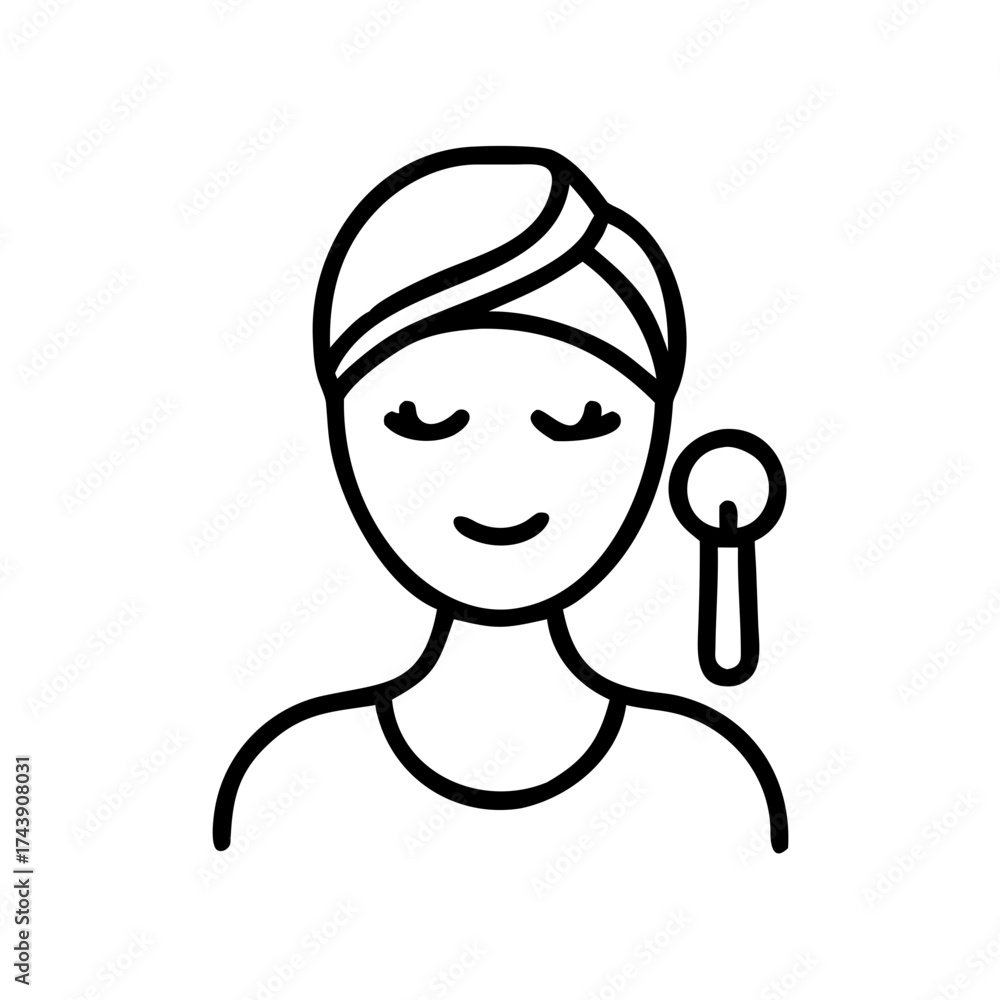 Obraz premium Woman relaxing with skincare tool and a head wrap 