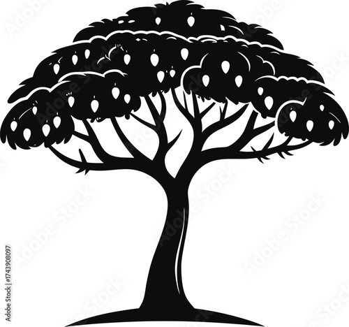 Silhouette of a lush fruit bearing tree