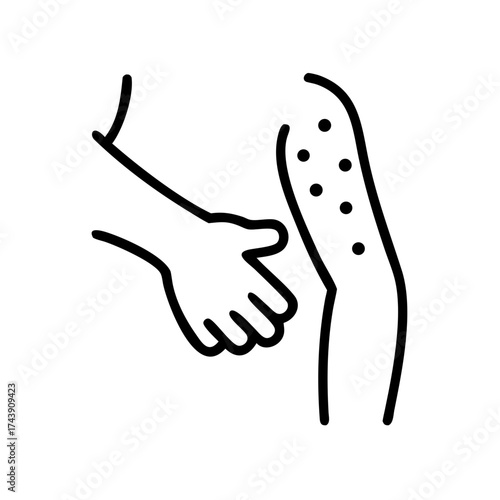 Hand examining skin rash on arm with visible red spots  