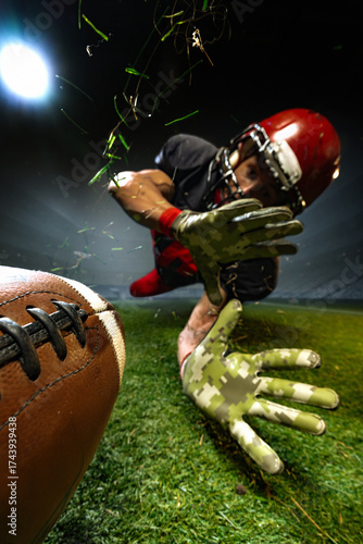 American football player diving to intercept ball on 3D field under night lights. Concept of sports branding, passion, and determination for advertising, web campaigns, and fitness visuals.
