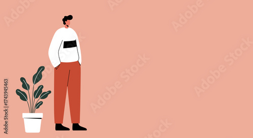 Relaxed man standing with hands in pockets next to a potted plant Modern lifestyle concept
