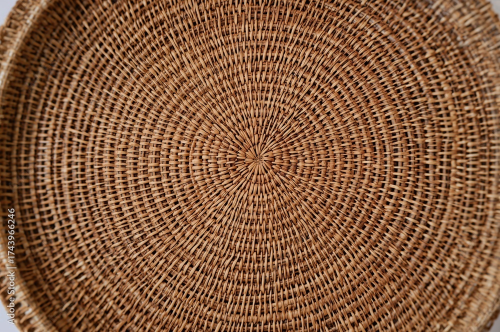 Fototapeta premium Circular woven wicker design texture or backdrop