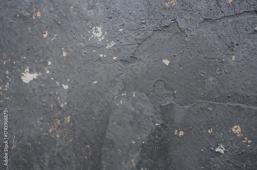 Close-up of coarse gray concrete surface with textured background