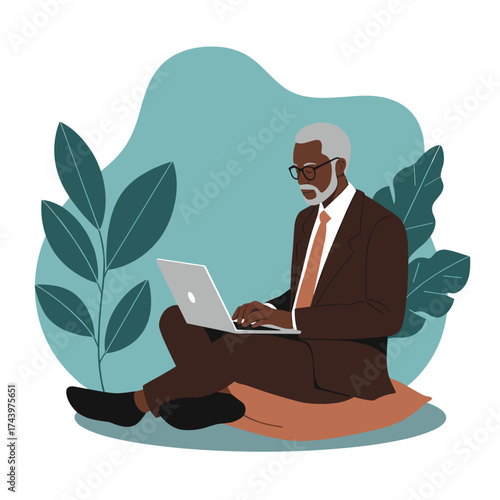 Focused senior businessman uses laptop comfortably in a relaxed setting blending work and lifestyle