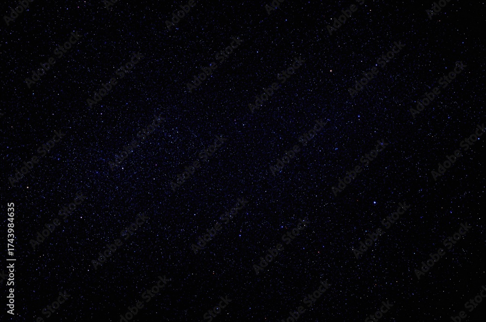 Obraz premium Twinkling constellations against a deep blue cosmic backdrop