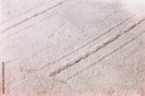 Cozy rug featuring an elega...