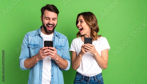 A couple is consumed by delight as they explore their smartphones, their expressions brimming with excitement and amusement against a vibrant backdrop.