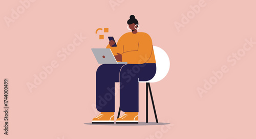 Person multitasking with laptop and smartphone for remote work or online communication