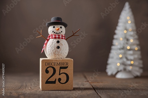 Wooden block holding a snow...