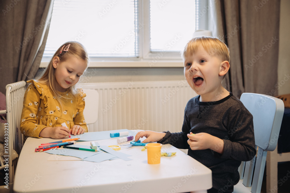 Fototapeta premium Children doing creative craft activities at home