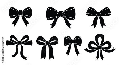 A collection of eight intricately designed black bows each with unique patterns and flowing ribbons.